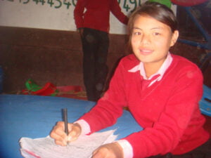 Sponsored Children writing letter to her sponser